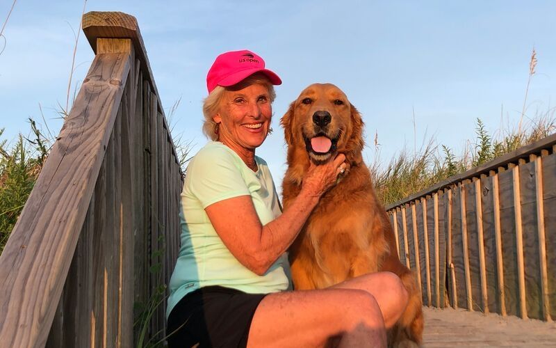 sitting on the beach walkover with my dog, Charley