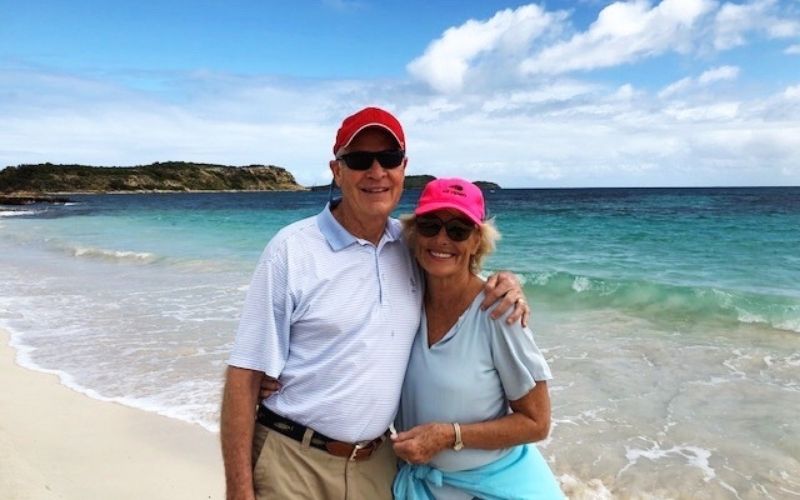 John and Susan standing on a beach