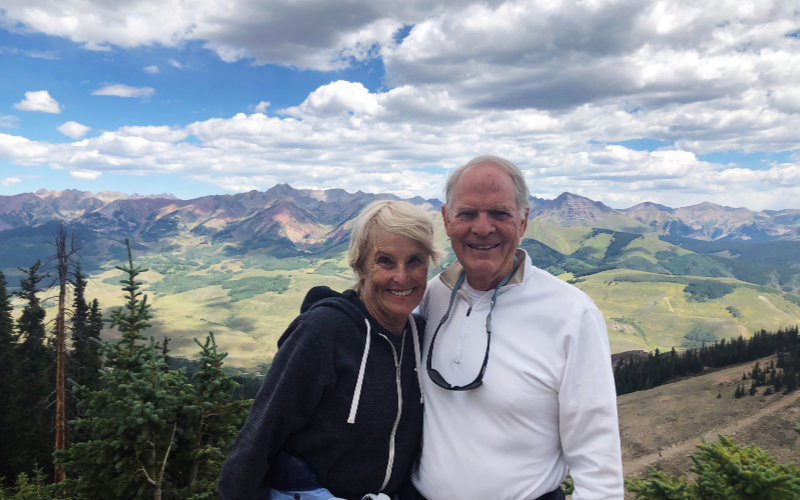 John and Susan with the Rocky Mountains in the background